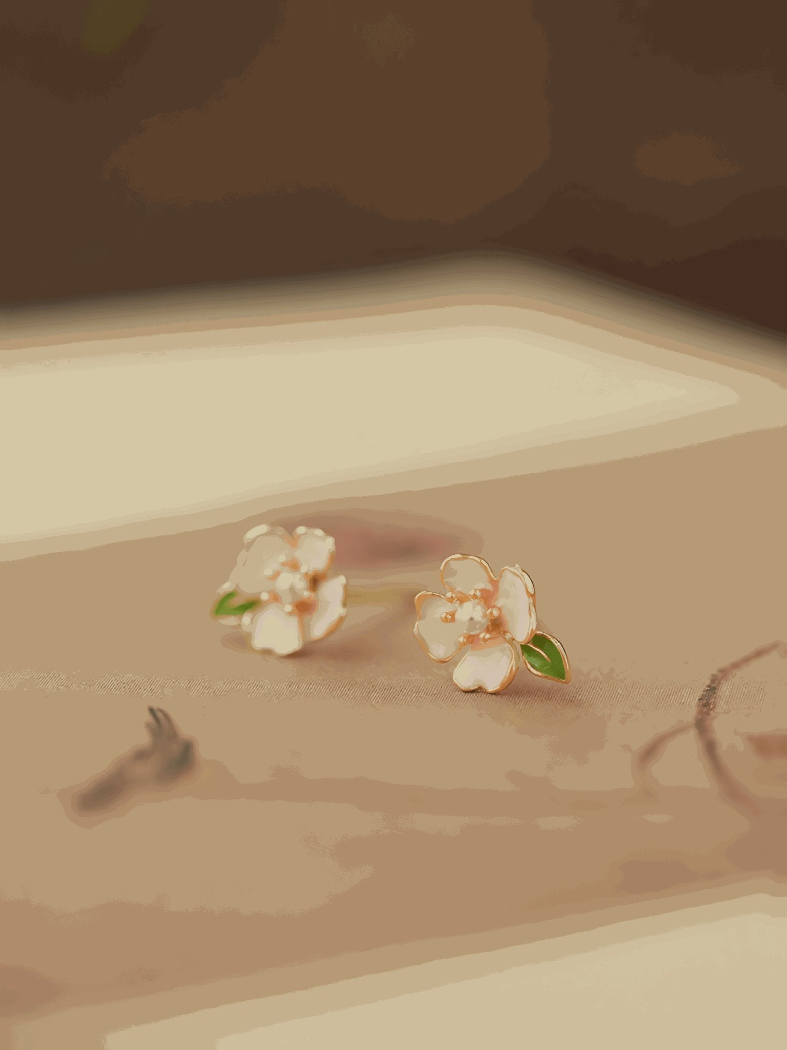Camellia Earrings, detail view of the handcrafted silver earrings