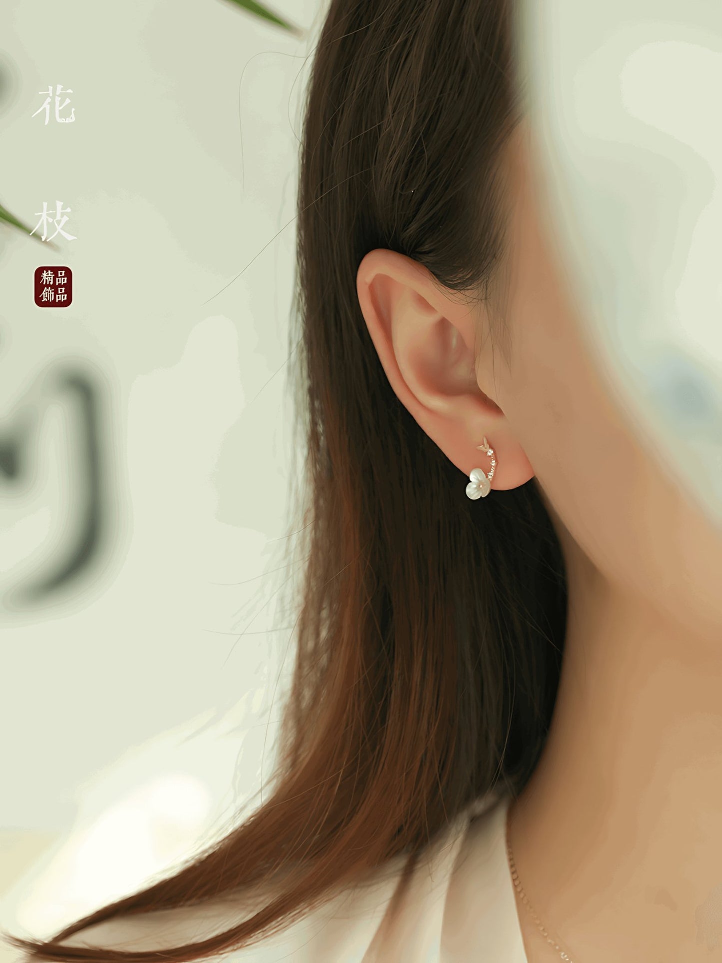 Flower Branch Gold, detail view of the handcrafted silver earrings