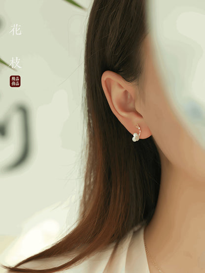 Flower Branch Gold, detail view of the handcrafted silver earrings