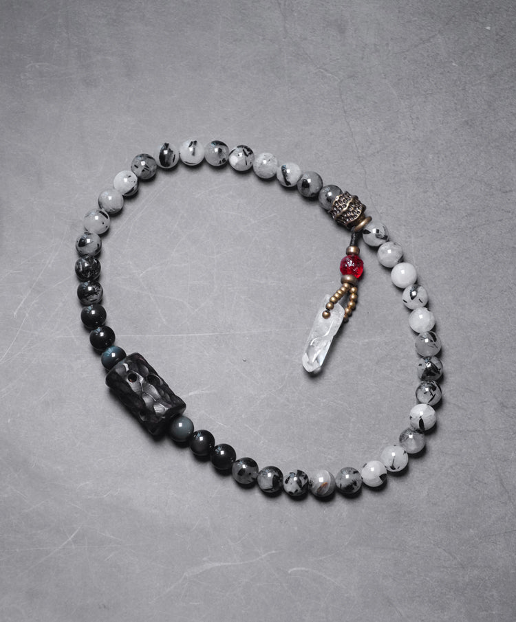 Chinese crystal bracelet with ink wash, detail view of the handcrafted silver bracelet