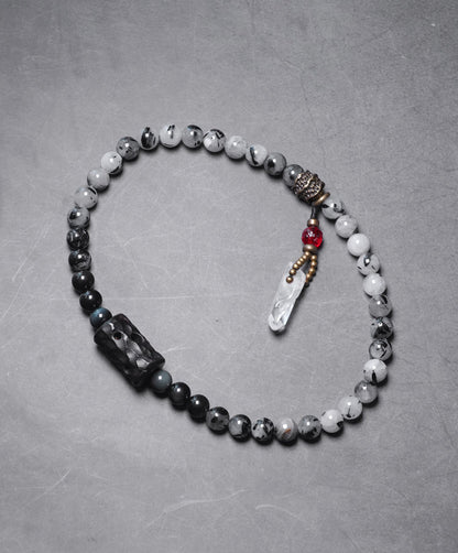 Chinese crystal bracelet with ink wash, detail view of the handcrafted silver bracelet