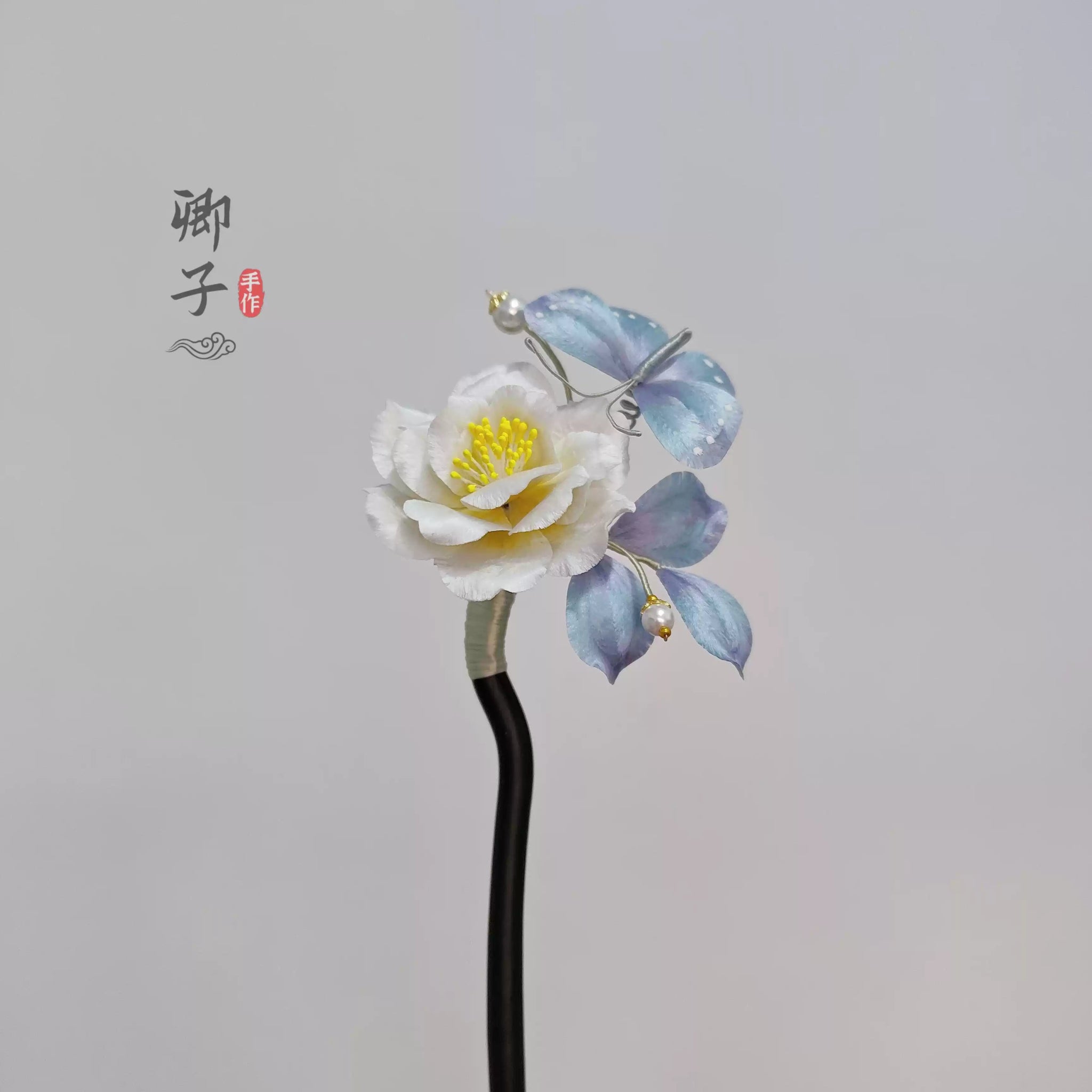 QianXiangYin Velvet Flower Hairpin, detail view of the handcrafted silk velvet flower hairpin